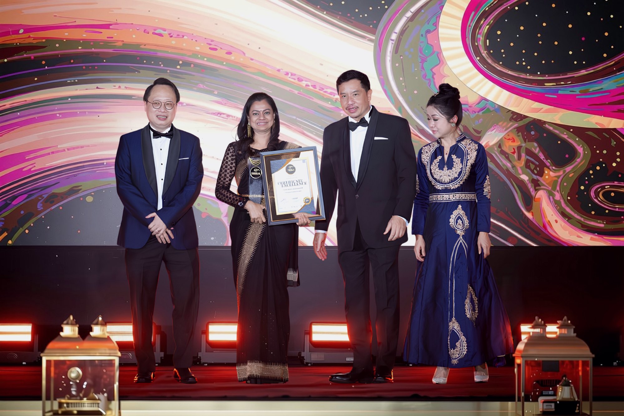 Datin Ratna Bai receiving Proforall\'s Certificate of Excellence at the Perdana and SEBA Awards